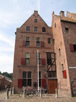 SX15016 Swallows flying over buildings at Elburg.jpg